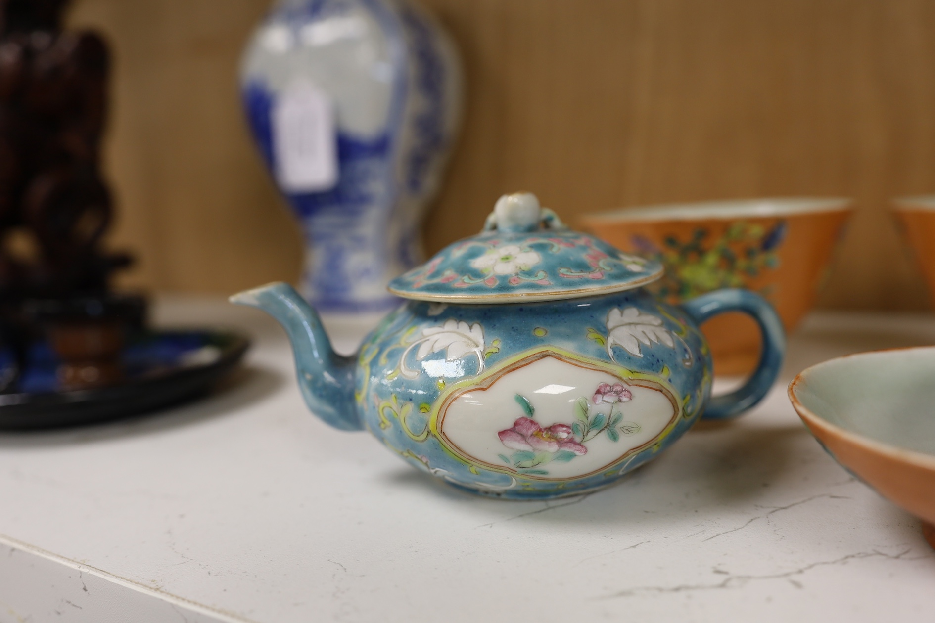 Two Chinese blue ground teapots, Tongzhi mark, and a pair of orange ground bowls and covers, teapots 15cm wide. Condition - fair